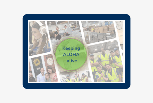 A collage of International Bridge team members across offices and warehouses, with a green circle overlay reading ‘Keeping ALOHA alive.