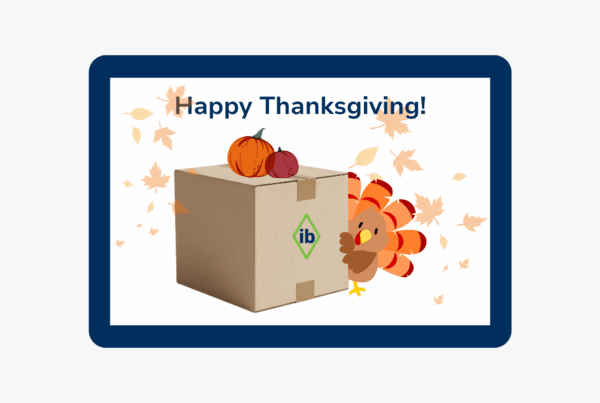 Carton box with IB logo, pumpkins, and a Thanksgiving turkey surrounded by falling autumn leaves, symbolizing holiday shipping.
