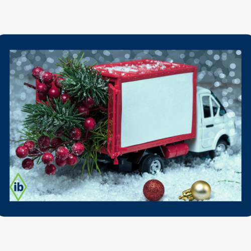 Holiday delivery truck carrying evergreen branches and ornaments, symbolizing thoughtful logistics and seasonal shipping care.