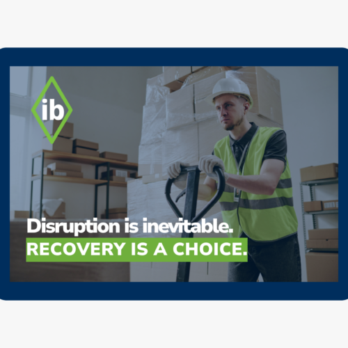 Logistics worker handling pallets in a warehouse with text “Disruption is inevitable. Recovery is a choice,” symbolizing resilient supply chain operations.