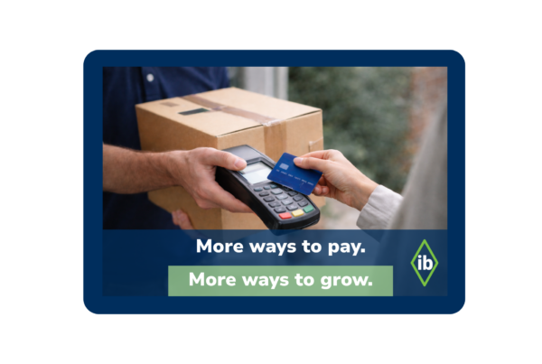 Customer paying courier with debit card at delivery using handheld payment terminal for USPS Collect on Delivery (COD) shipment.